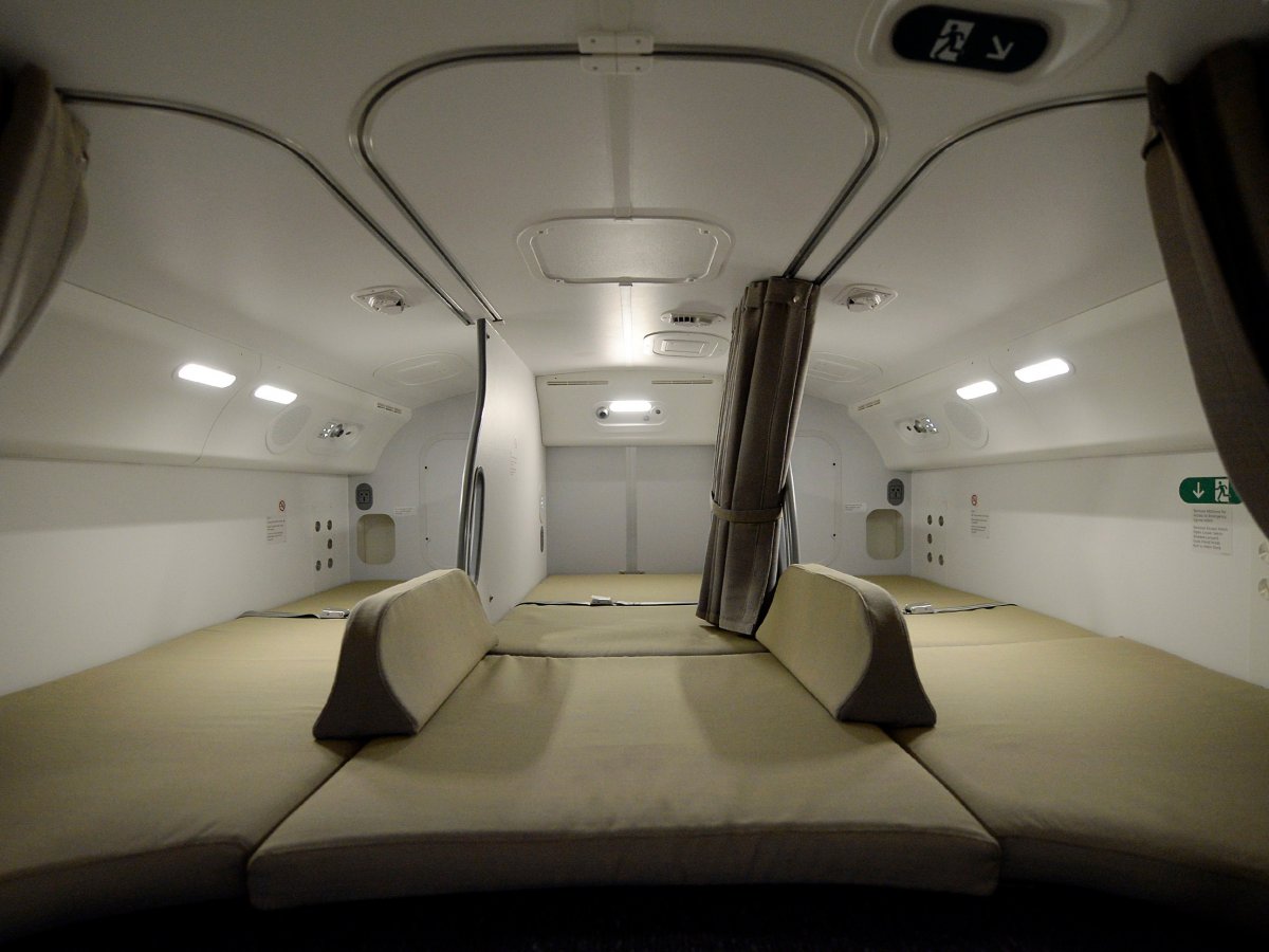though-some--and-this-varies-by-airline--are-a-little-more-high-end-and-feature-entertainment-systems-some-airplanes-like-air-canadas-boeing-787-dreamliner-have-flat-open-sleeping-areas